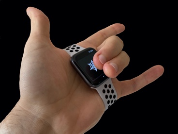 Picture of an Apple Watch strapped to the palm of your hand, making the webshooting hand pose like Spider-Man, whilst tapping on the button to make it fire up the sound effect — it's fun